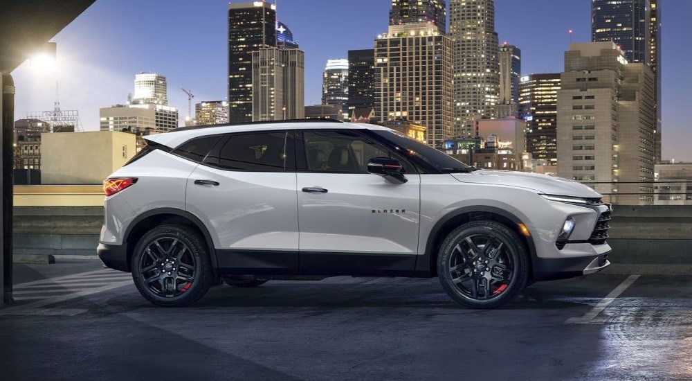 A side angle view of a white 2024 Chevy Blazer Redline.