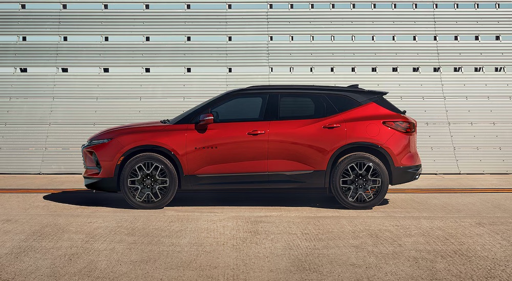A red 2024 Chevy Blazer RS parked at a side angle.