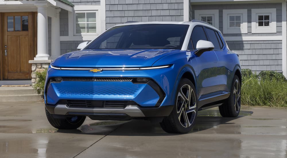 A blue 2024 Chevy Equinox EV for sale is shown from the front at an angle.