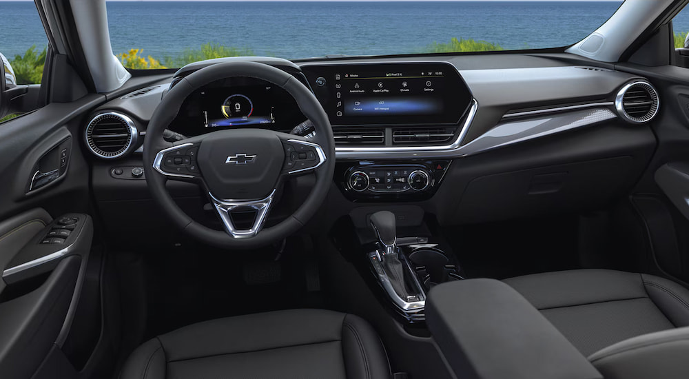 The black interior cabin of a 2025 Chevy Trax.