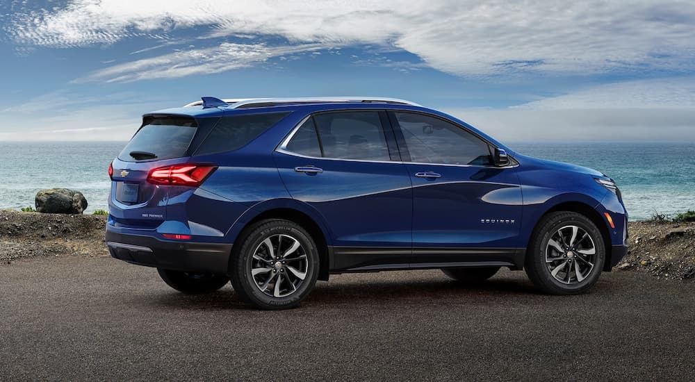Blue 2022 Chevy Equinox parked in an empty lot.