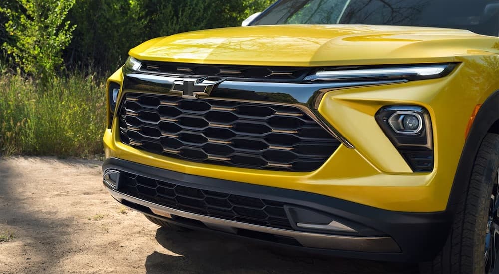 Close-up on the grille and badge of a yellow 2026 Chevy Trailblazer ACTIV for sale.