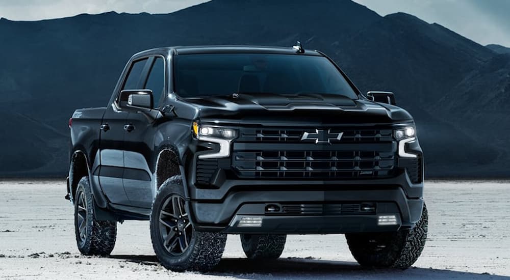 Black 2026 Chevy Silverado 1500 parked off-road.