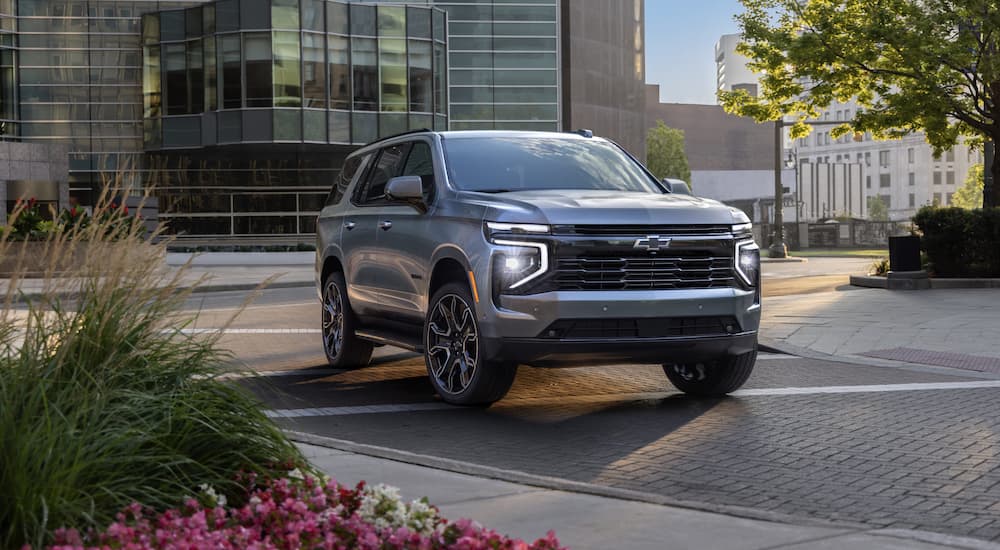 Grey 2026 Chevy Tahoe driving on a city street