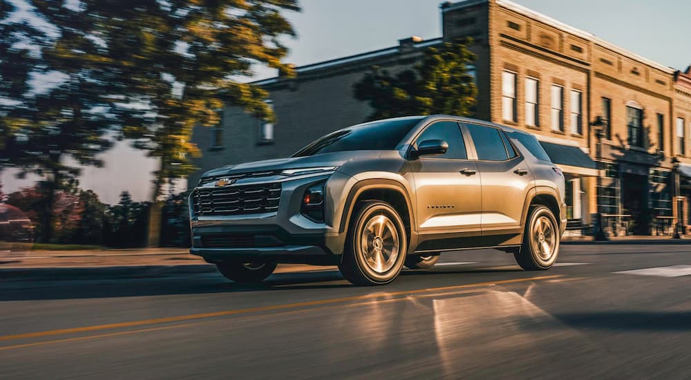 Grey 2026 Chevy Equinox driving on a city street