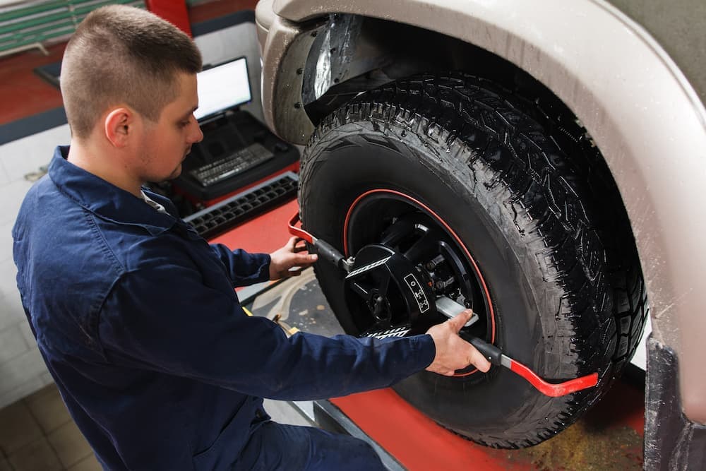 A technician working on a tire.