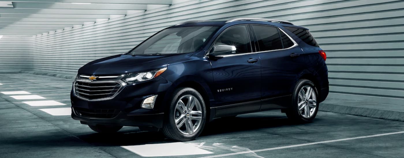 Dark blue 2020 Chevy Equinox parked in a parking garage.
