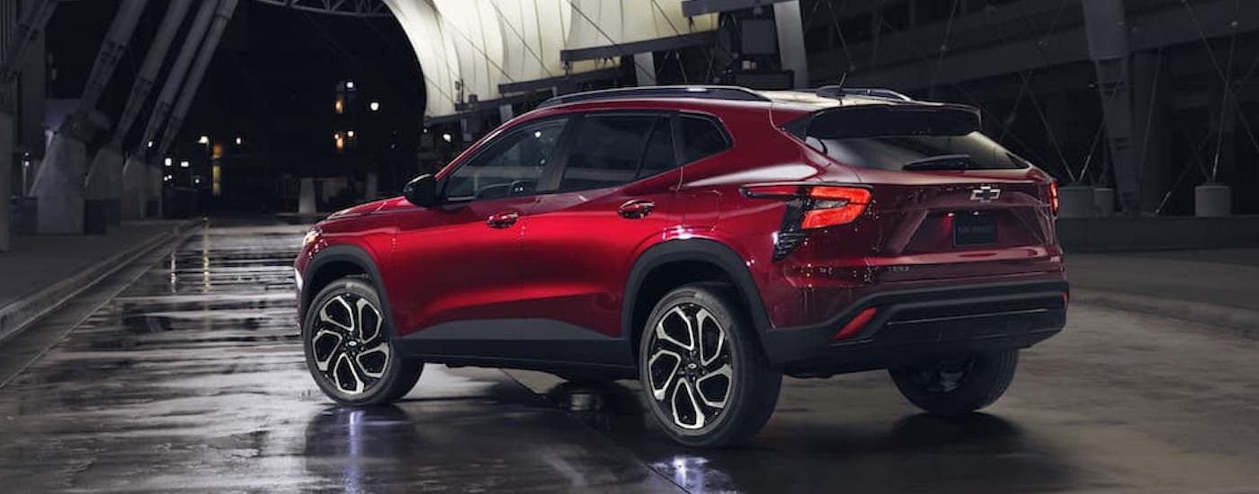 A red 2024 Chevy Trax RS is shown from the rear at an angle.