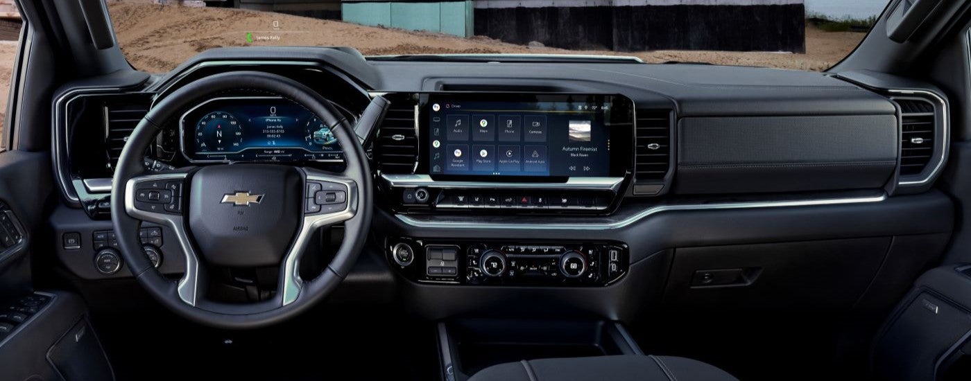 The dashboard and steering wheel inside of a 2026 Chevy Silverado 3500 HD.