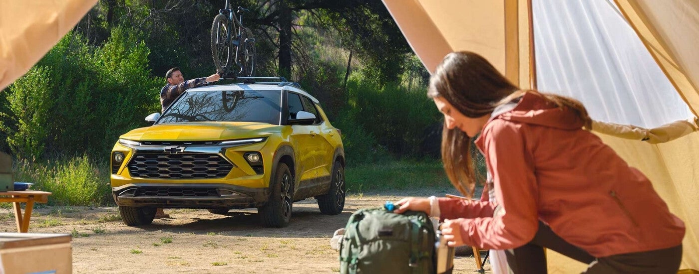 Yellow 2024 Chevy Trailblazer ACTIV parked on a campsite