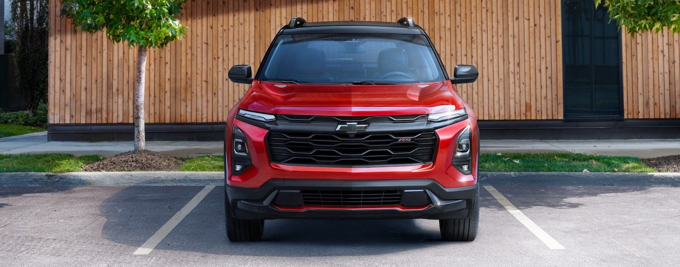Front view of a red 2025 Chevy Equinox RS parked on a parking lot.