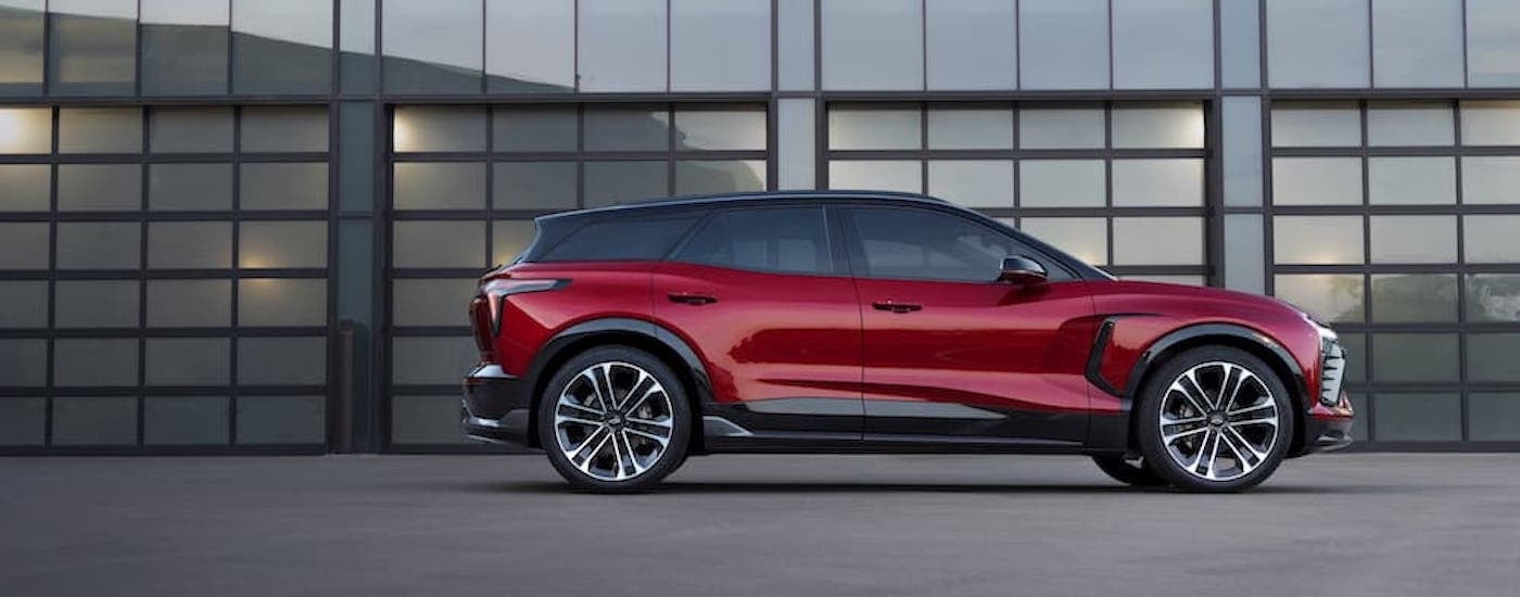 A red 2025 Chevy Blazer for sale in Dexter from the side.